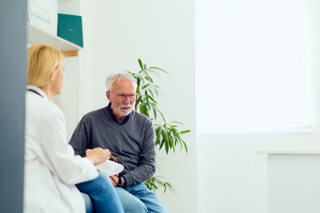 Senior man with doctor
